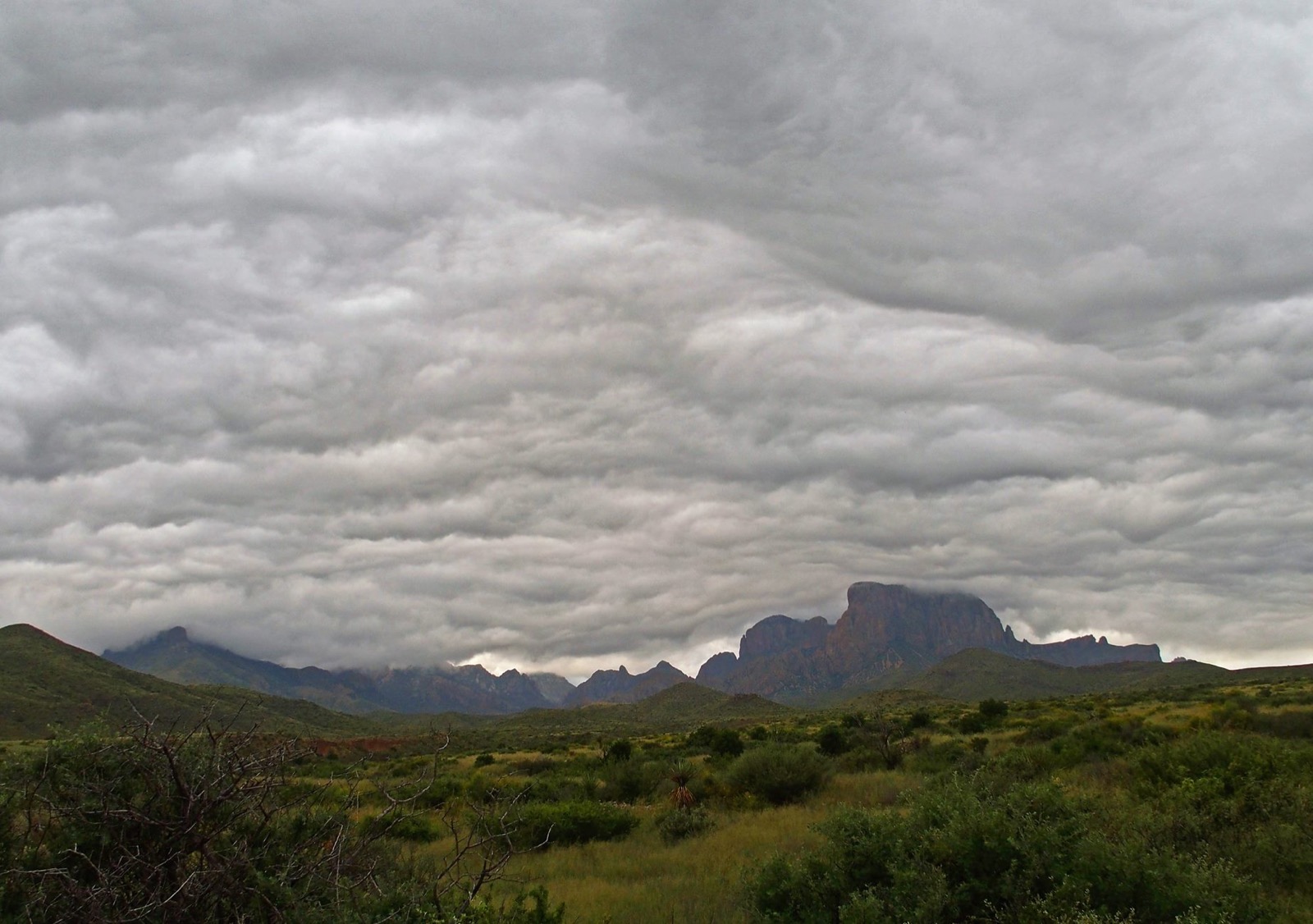 Storm clouds building over flat open country
