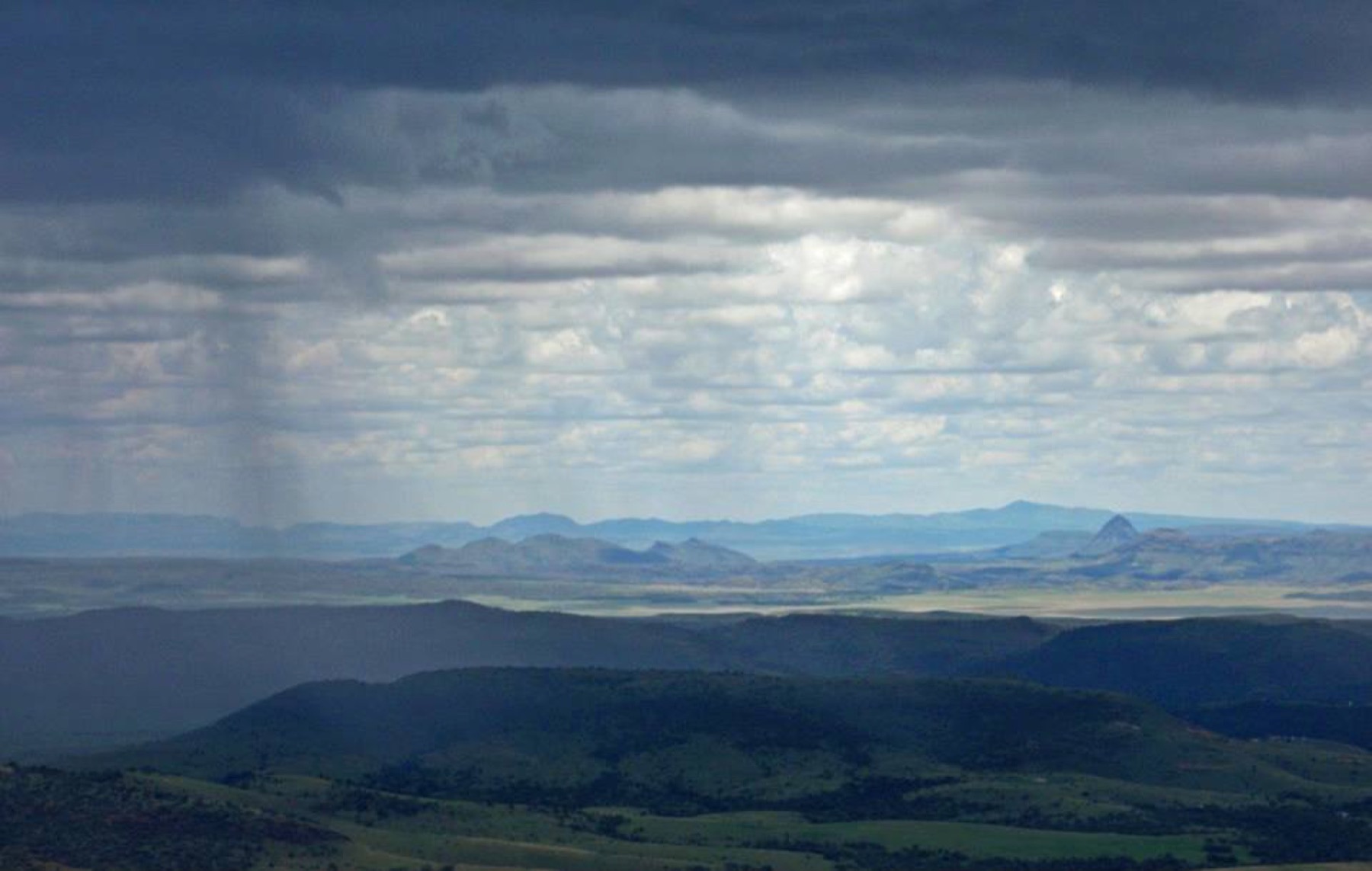 Rain moving across open country